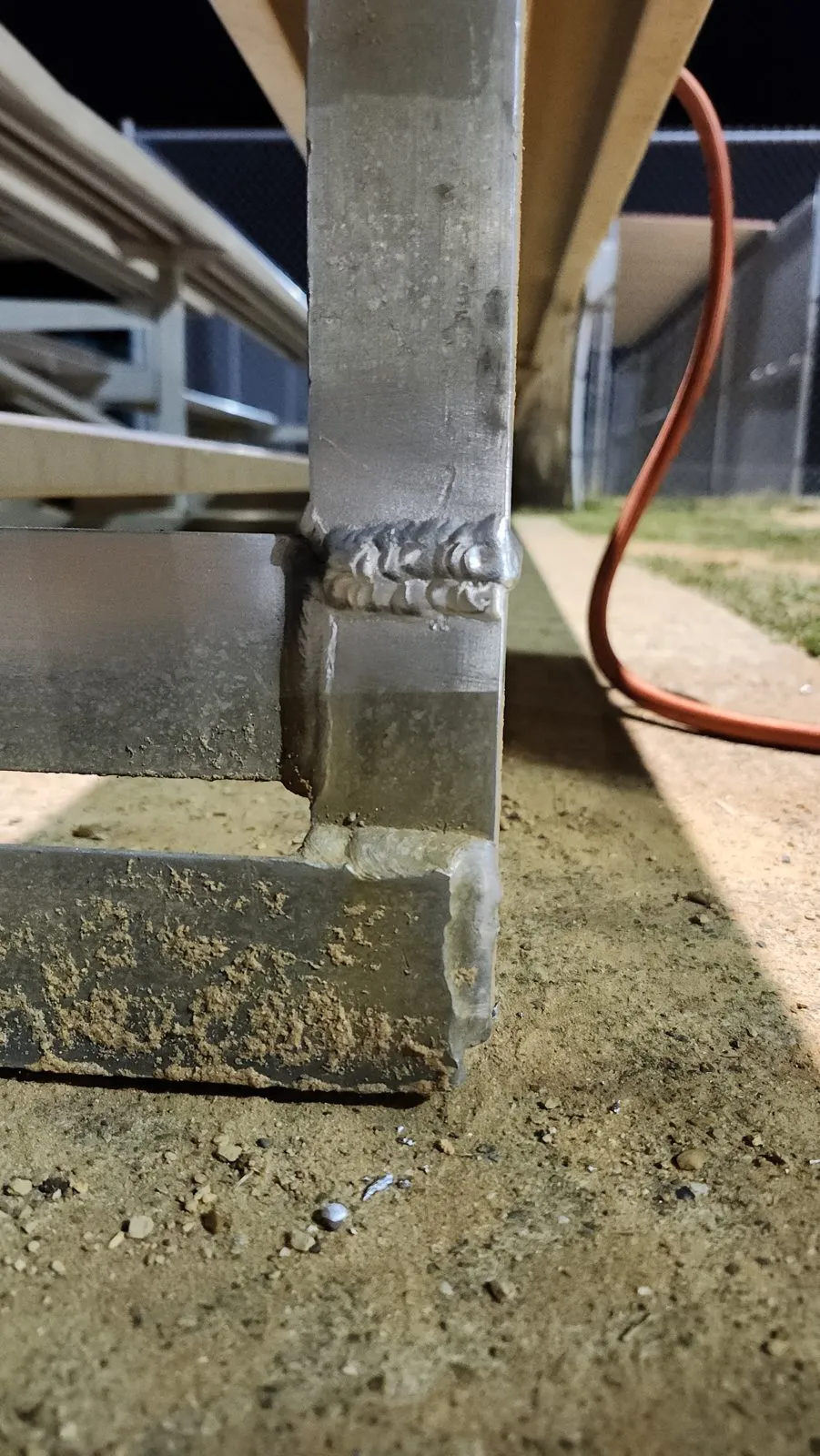 The same post after repair, the crack welded out and the joint rewelded to the base plate.